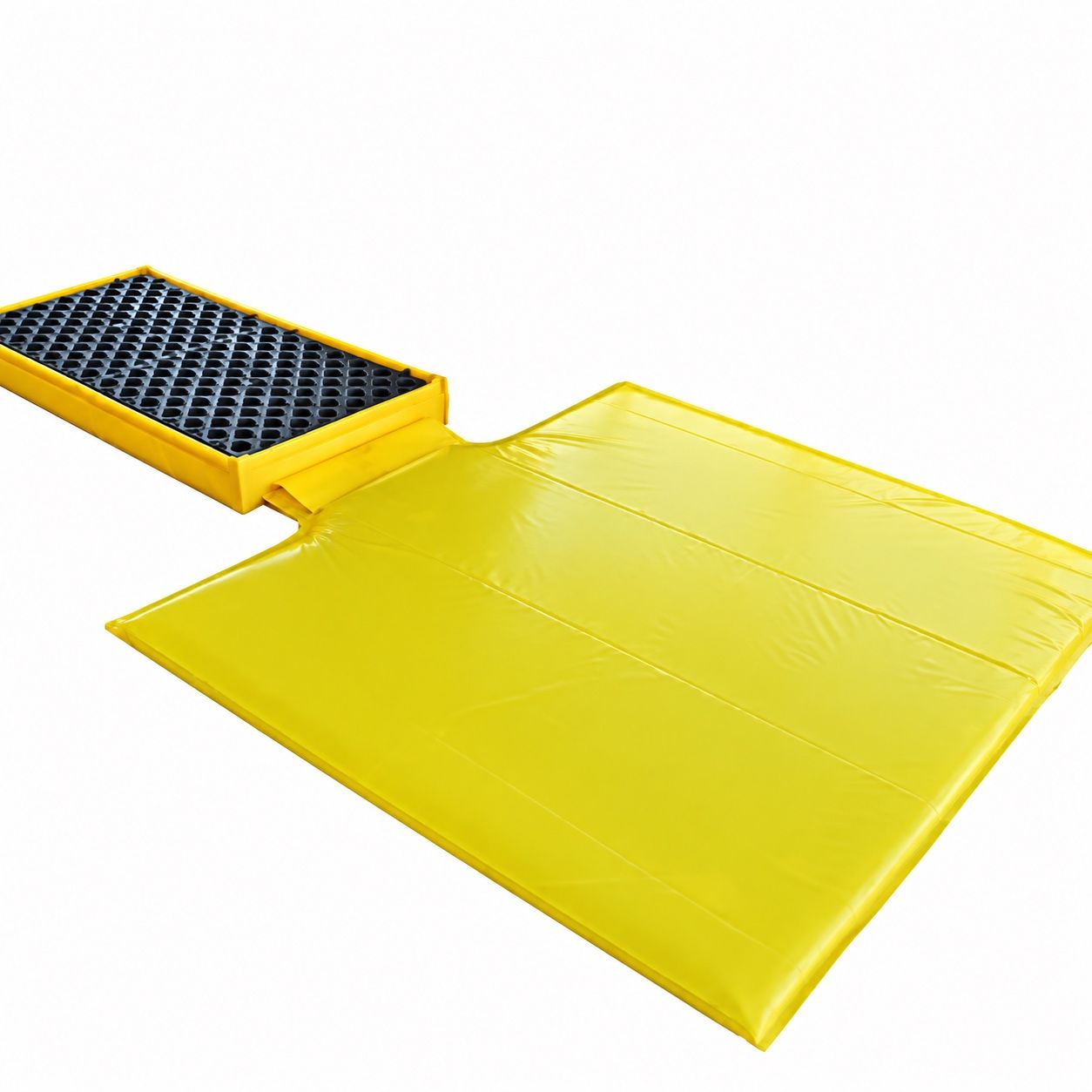 Yellow flexible spill deck with a black removable grating, shown beside a large folded PVC bladder that deploys from the edge of the deck in a large spill